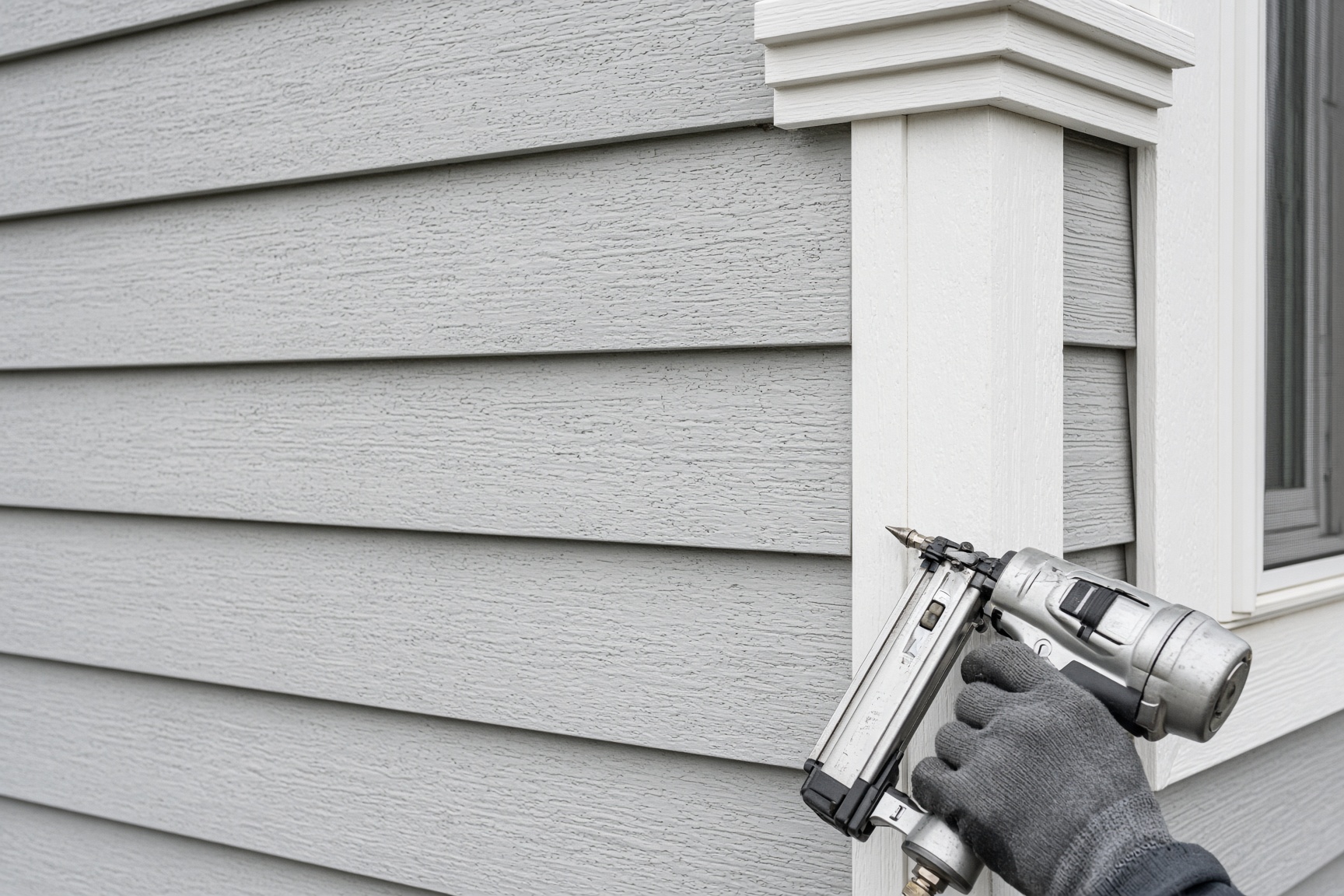 Close view of finished lap siding and trim